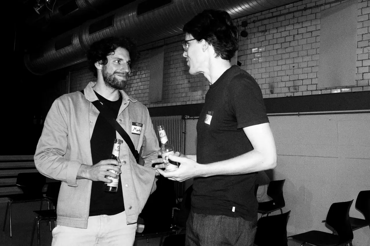 Two attendees talking